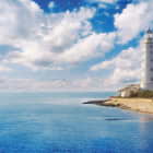 Мініатюра фотошпалер Маяк і море
